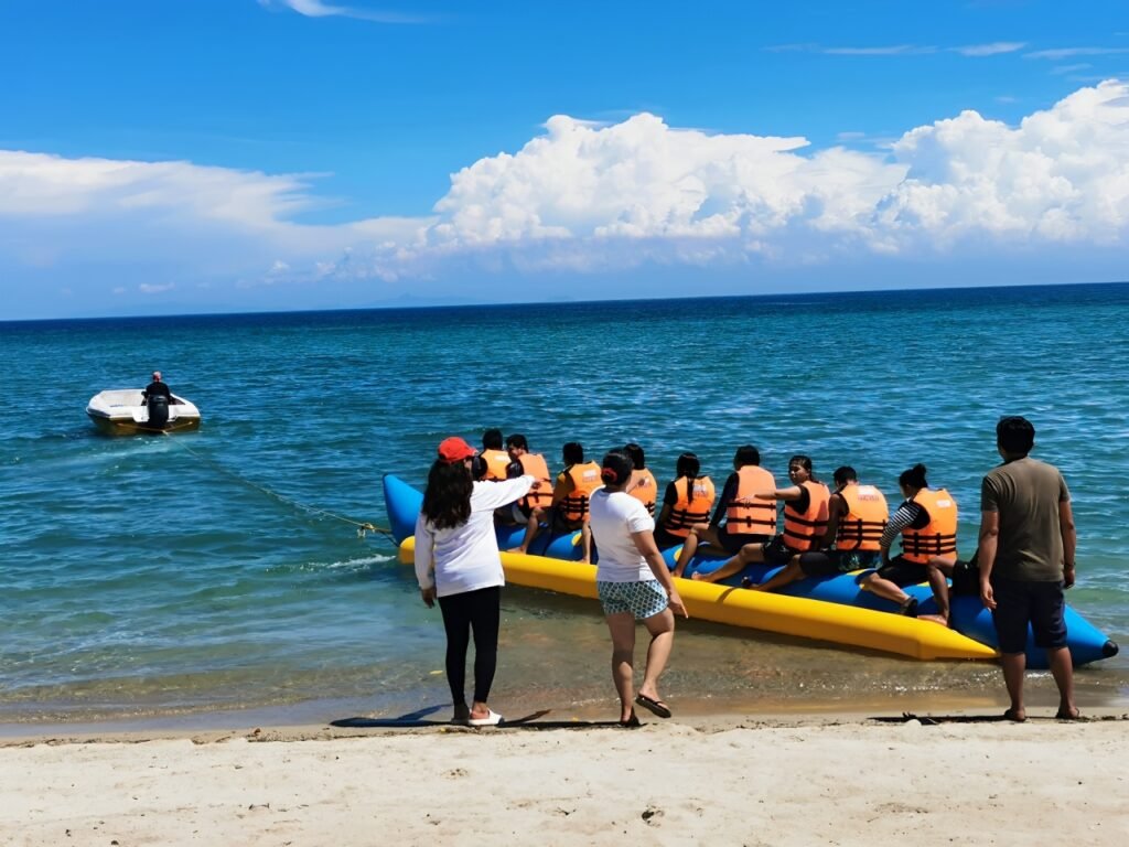 Group of People riding a banana boat at One Laiya